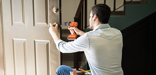 Residential Locksmith Installing Lock